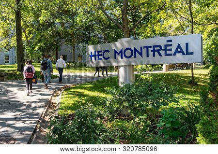 Montreal, Ca - 5 September 2019: Students Passing By Hec Montreal Sign