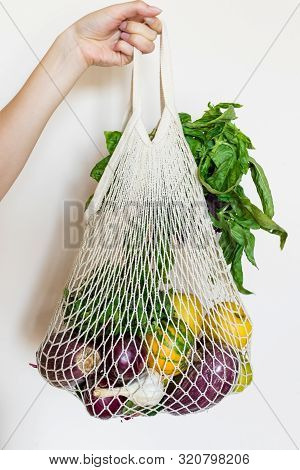 Zero Waste Cconcept. Package-free Food Shopping. Female Hand With Eco Friendly Natural Bag With Orga