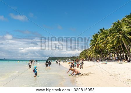 Balabag, Boracay Island, Philippines - March 4, 2019: White Beach Shows Sand And Azure Sea With Wall