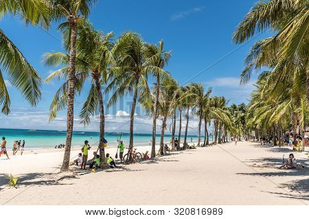 Balabag, Boracay Island, Philippines - March 4, 2019: White Beach Shows Sand And Azure Sea With Tow 