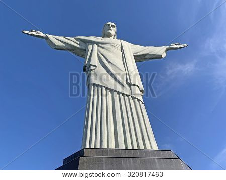 Rio De Janeiro, Brazil - June 16, 2019: Statue Of Christ The Redeemer On Top Of Mount Corcovado In R