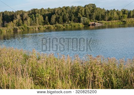 Small Lake In The Forest. Lake In Russia. Lake Shore. To Fish On The Lake. Beautiful Landscape. Admi