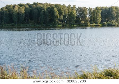 Small Lake In The Forest. Lake In Russia. Lake Shore. To Fish On The Lake. Beautiful Landscape. Admi