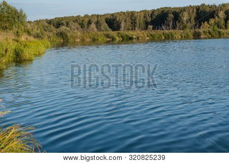 Small Lake In The Forest. Lake In Russia. Lake Shore. To Fish On The Lake. Beautiful Landscape. Admi