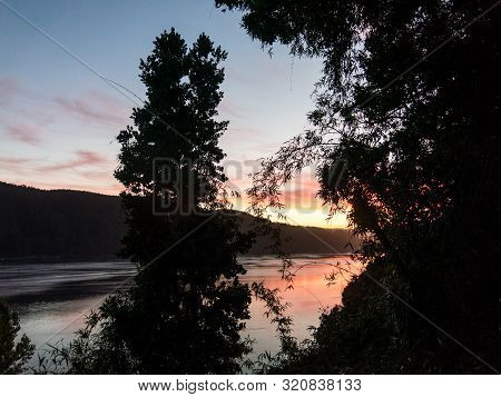 Sunset At The Mouth Of The Valdivia River, Near The City Of The Same Name, In The Region Of The Rive