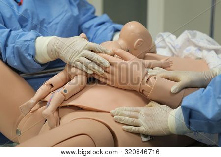 Details With Plastic Dummies Representing A Woman And Her Newly Born Baby Used By Medics And Midwive