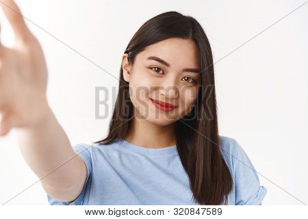 Tender Cute Happy Brunette Asian Girl Record Video Message Extend Arm Forward Hold Camera Smartphone