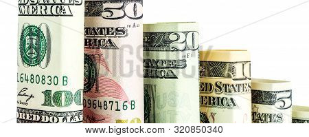 Declining Steps Made Of Blocks Of All American Dollar Denomination Banknotes In One Row On White Bac