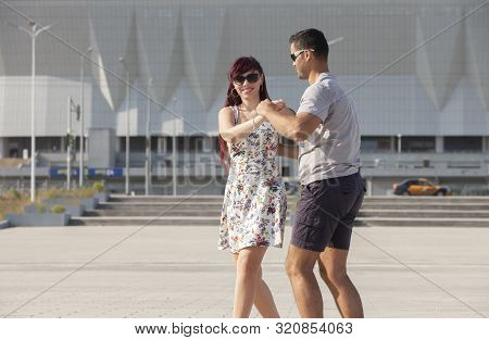Young Couple Dances Caribbean Salsa. Social Activity Concept.