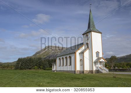 Valberg Church, Vestvagoy, Norway, against a blue sky