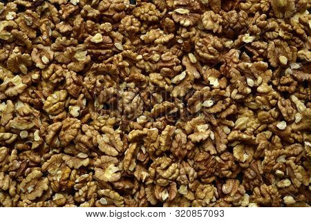 Heap Of Raw Peelled Organic Walnuts. Top View With Copy Space.