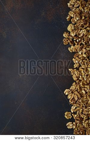 Heap Of Raw Peelled Organic Walnuts. Top View With Copy Space.