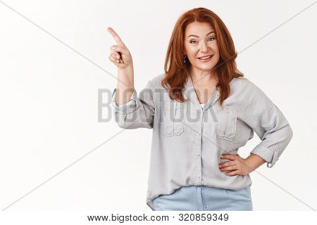 Good-looking Elegant Middle-aged 45s Pleasant Woman Redhead Hold Hand Waist Self-assured Smiling Ent