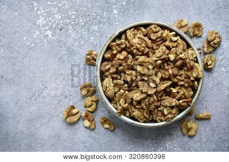 Bowl Of Peelled Walnuts. Top View With Copy Space.