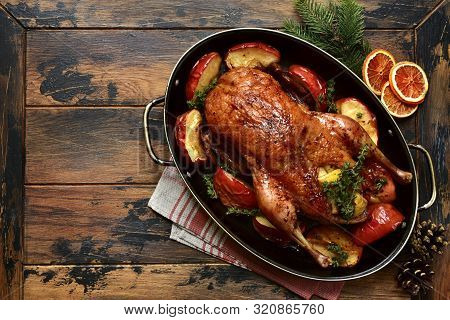 Roast Goose Stuffed With Baked Apples In A Skillet, Festive Christmas Recipe. Top View With Copy Spa