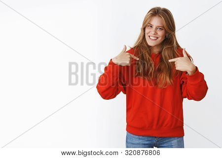 Happy Carefree Good-looking Young Female With Natural Fair Hair, Freckles And Blue Eyes Standing In 