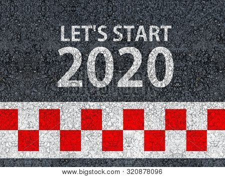 Happy New Year 2020. Lets Start 2020 And Racing Start Line Written On An Asphalt Road