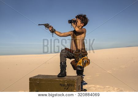 Post-apocalyptic Boy Outdoors In The Desert. Nuclear Post-apocalypse. Life After Doomsday Concept. D