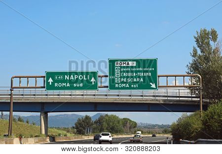 Italian Road Sign On Motorway Near Rome City And The Arrows Directions To Naples