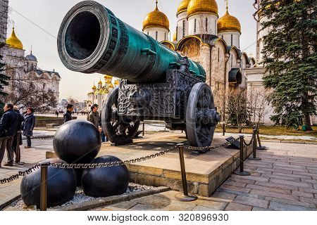 Moscow, Russia, April 2013 Tourists Visiting Kremlin Looking At Huge Old Cannon, Tsar Pushka, With D