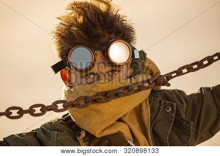 Post-apocalyptic Cyberpunk Boy Outdoors. Closeup Portrait. Nuclear Post-apocalypse Time. Life After 