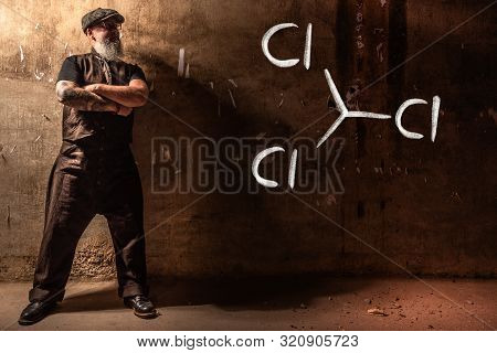 Bearded Old Man Presenting Handdrawn Chemical Formula Of Trichloromethane Cloroform