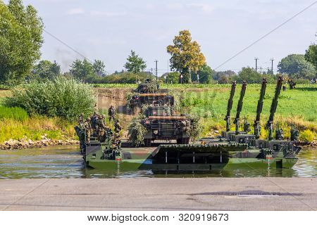 Minden / Germany - September 4, 2019: Panzerpionierbattaillon Trained A Tank Crossing Over A River W