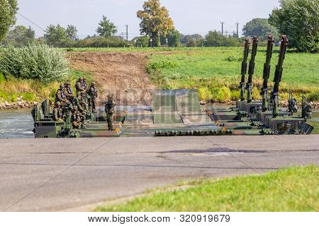 Minden / Germany - September 4, 2019: Panzerpionierbattaillon Trained A Tank Crossing Over A River W