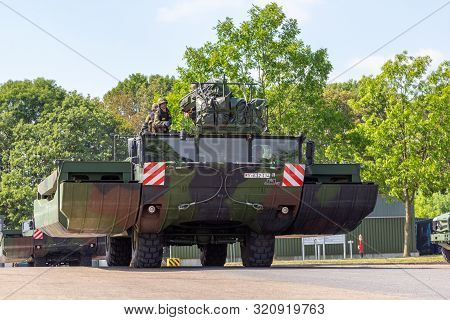 Minden / Germany - September 4, 2019: Panzerpionierbattaillon Trained A Tank Crossing Over A River W