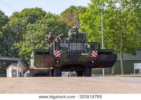 Minden / Germany - September 4, 2019: Panzerpionierbattaillon Trained A Tank Crossing Over A River W