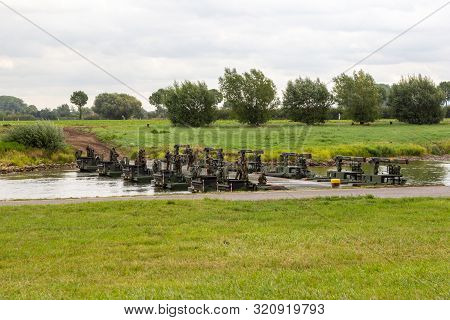 Minden / Germany - September 4, 2019: Panzerpionierbattaillon Trained A Tank Crossing Over A River W