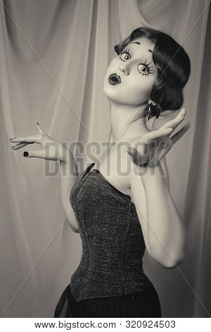 Fun Young Woman With Vintage Pinup Makeup Making Dolly Face Looking At Camera, Monochrome