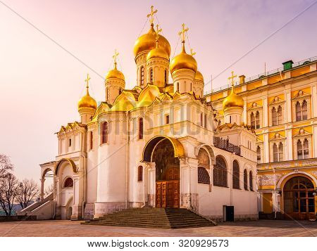 Cathedral Of The Annunciation With Majestic Golden Copulas Or Domes In Kremlin At Beautiful Sunrise,