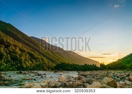 Svaneti Landscape At Sunset With Mountains And River On The Trekking And Hiking Route Near Mestia Vi