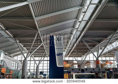 Warsaw, Poland - July 2019: Warsaw Chopin Airport Architecture And Passengers Inside. Warsaw Chopin 