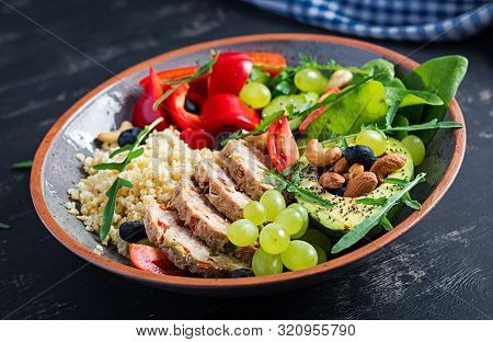 Buddha Bowl Dish With Meatloaf, Bulgur, Avocado, Sweet Pepper, Tomato, Cucumber, Berries And Nuts. D