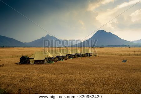 Swiss Tents In The Sand Surrounded By Eastern Ghat Mountain Range With Copy Space