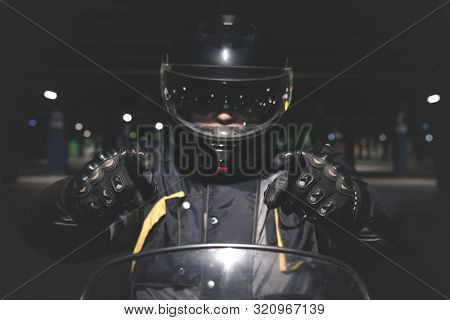 Biker Is Showing Ahead By His Index Fingers.