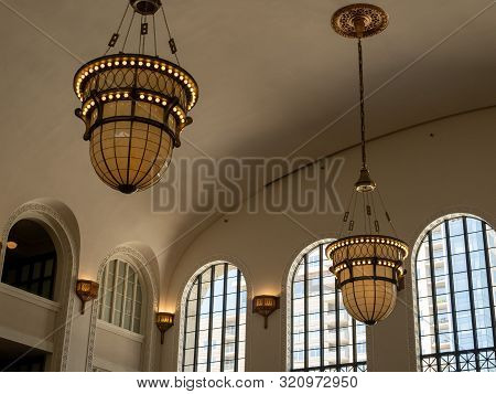 Onate Chandeliers Hanging During Daytime In Large Building Clean