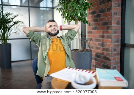 Bearded Man Feeling Satisfied After Studying At The Weekend