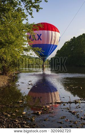 Festival Goers Watch Hot Air Balloons Take To Flight Early Saturday Morning, August 3, 2019 At The S