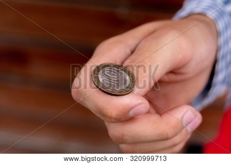 Close Up Shot Of Hand Toss A Coin, Probable And Winning Chances Concept, Fifty-fifty S