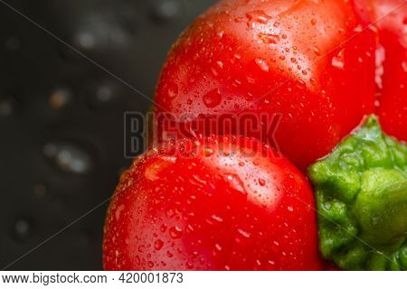 Fresh Red Bell Pepper On Black Background. Top View Tropical Abstract Background. Cloe Up Pepper Veg