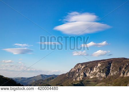flying saucer shaped white cloud