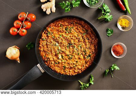 Keema Curry In Frying Pan Over Dark Background. Indian And Pakistani Style Dish. Top View, Flat Lay,