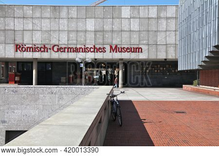 Cologne, Germany - September 22, 2020: People Walk By Romisch-germanisches Museum In Cologne City, G