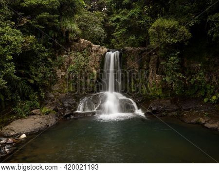 Long Exposure Panorama Of Idyllic Tropical Kauri Tree Forest Waterfall Waiau Falls At 309 Road Corom