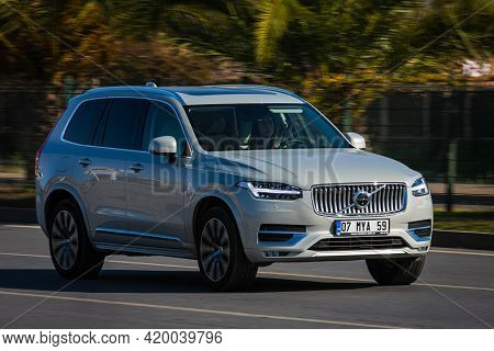 Alanya, Turkey - April 18 2021:  White Volvo Xc90 Is Driving Fast On The Street On A Warm Summer Day