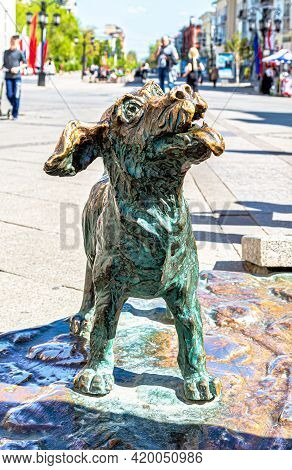 Samara, Russia - May 6, 2021: Sculpture Small Bronze Dog. Fragment Of The Monument 