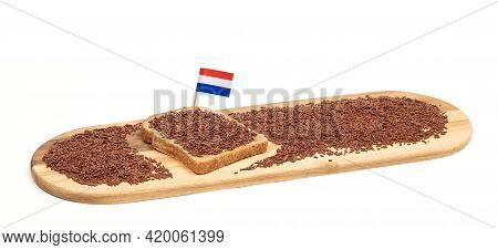 Typical Dutch Chocolate Sprinkles (hagelslag) On A Slice Of Bread, Served On A Wooden Plate, Isolate